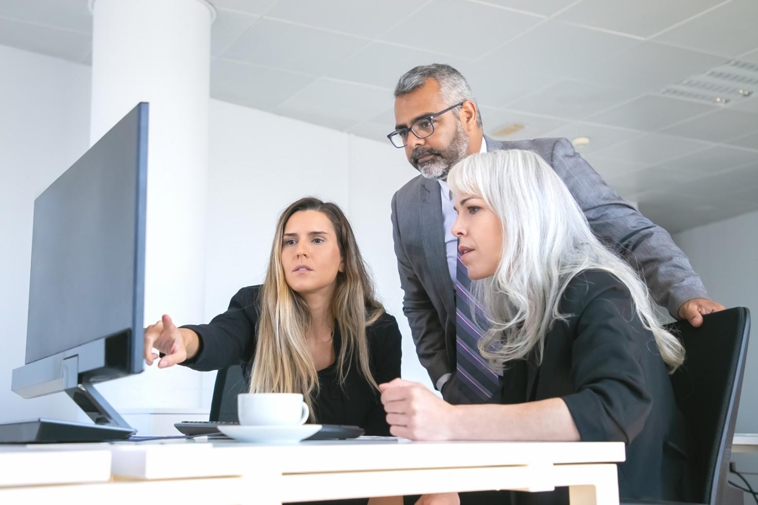 Financial planning consultation showing detailed cash flow analysis and strategic planning documents